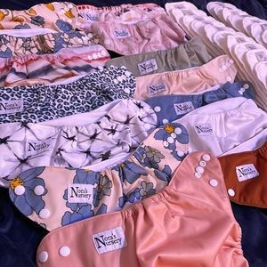 Nora’s Nursery (12) diapers and (22) bamboo inserts plus diaper liners (2 rolls)